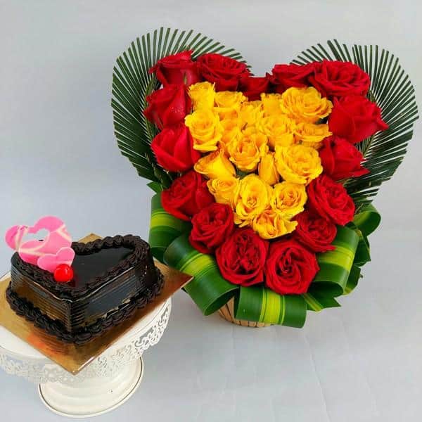 Heart shape arrangement of Rose with cake