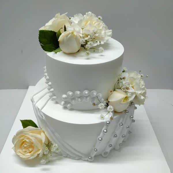 Send double heart shape cake with flower design on top online by GiftJaipur  in Rajasthan